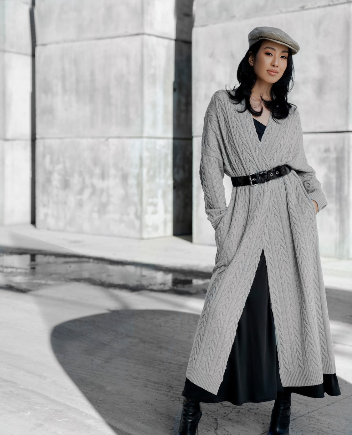 Cashmere cable-knit long cardigan, flat lay, featuring intricate knit detailing and a cozy, elegant design.
