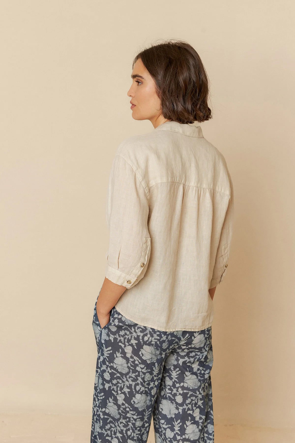 Model dressed in a breathable short sleeve linen shirt.