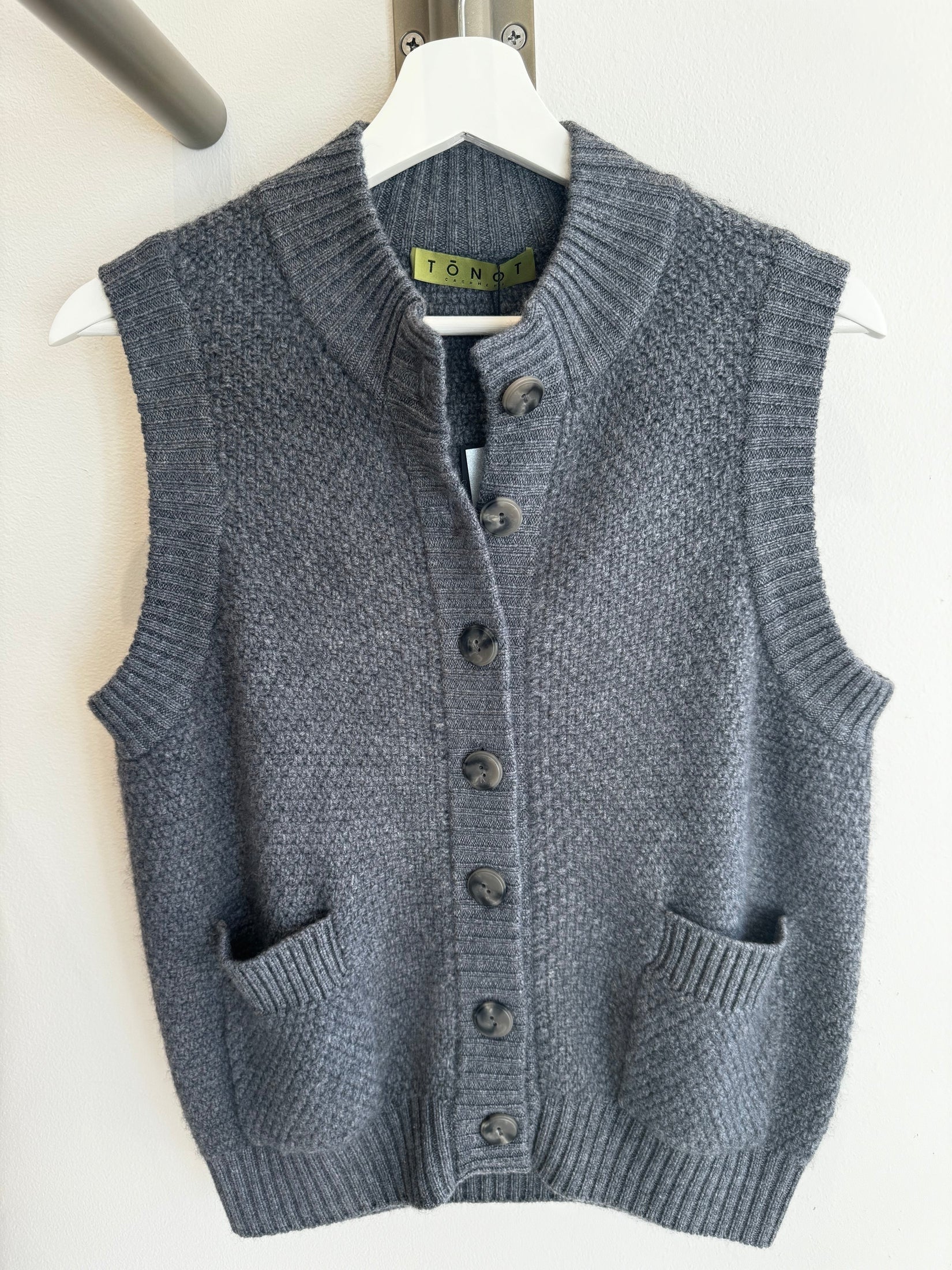 Grey contemporary cashmere moss stitch button vest.