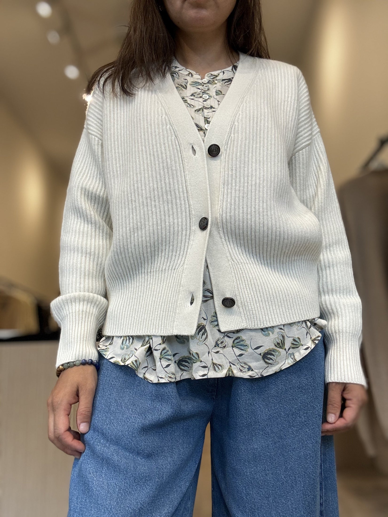 White rib knit cashmere cardigan with 3 buttons.