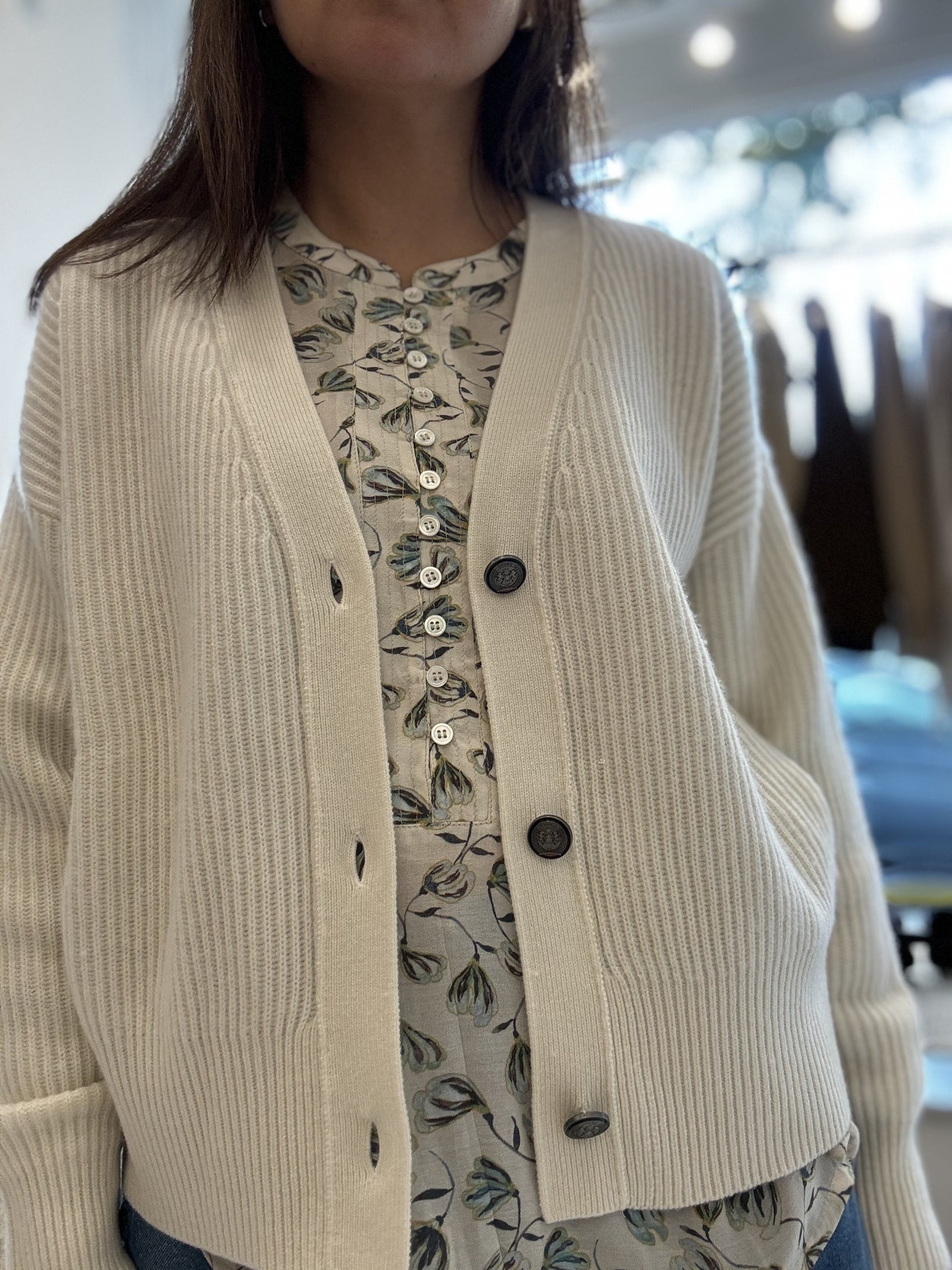 White rib knit cashmere cardigan with 3 buttons.