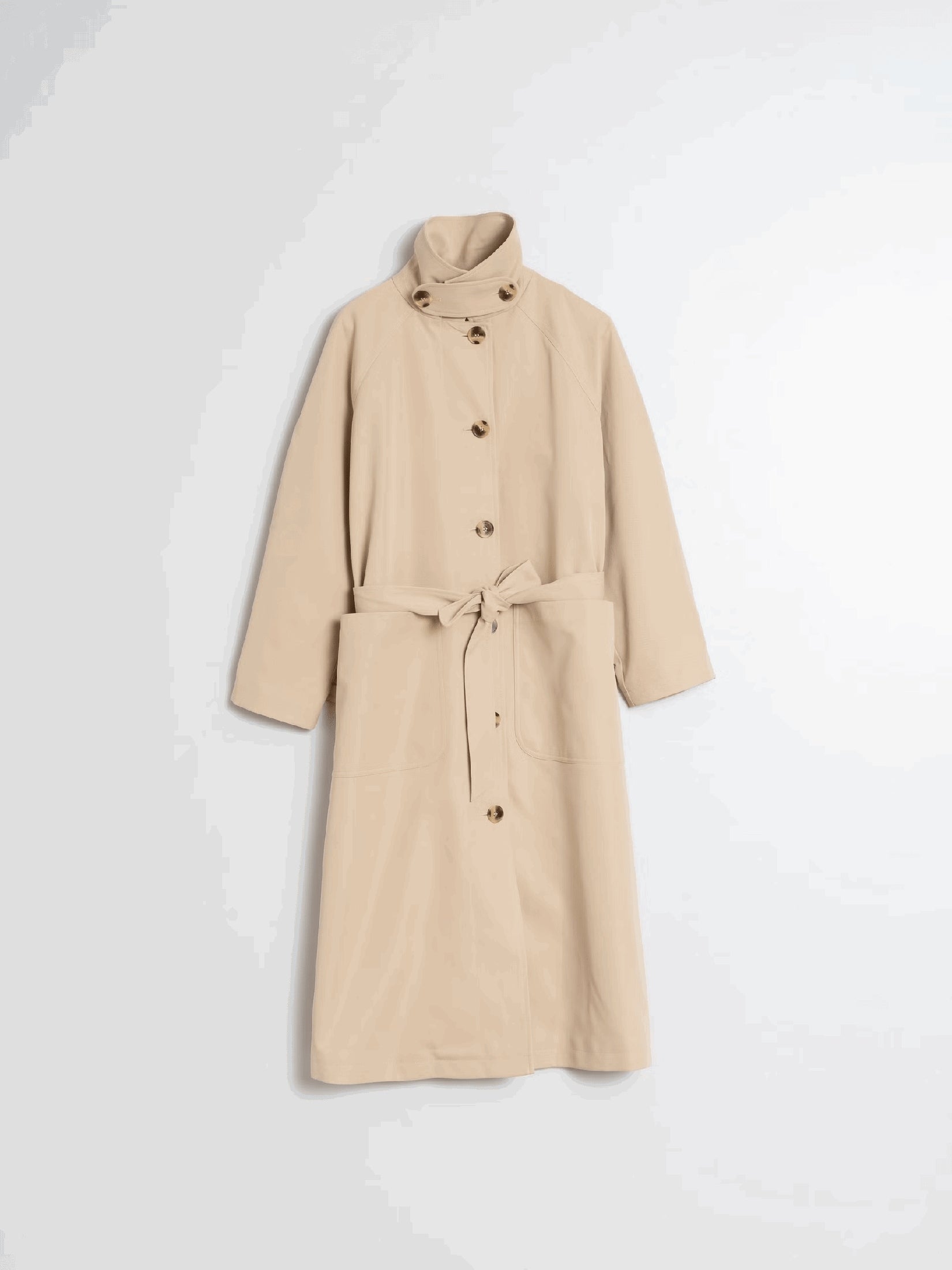 Flat lay of a beige trench coat with belt.