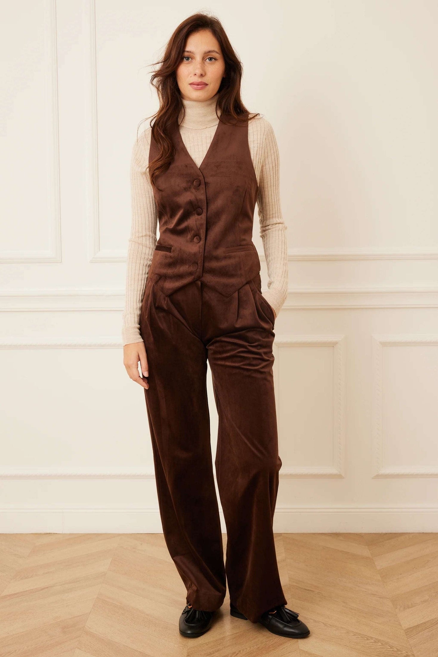 Model wearing brown velour pants and matching vest.