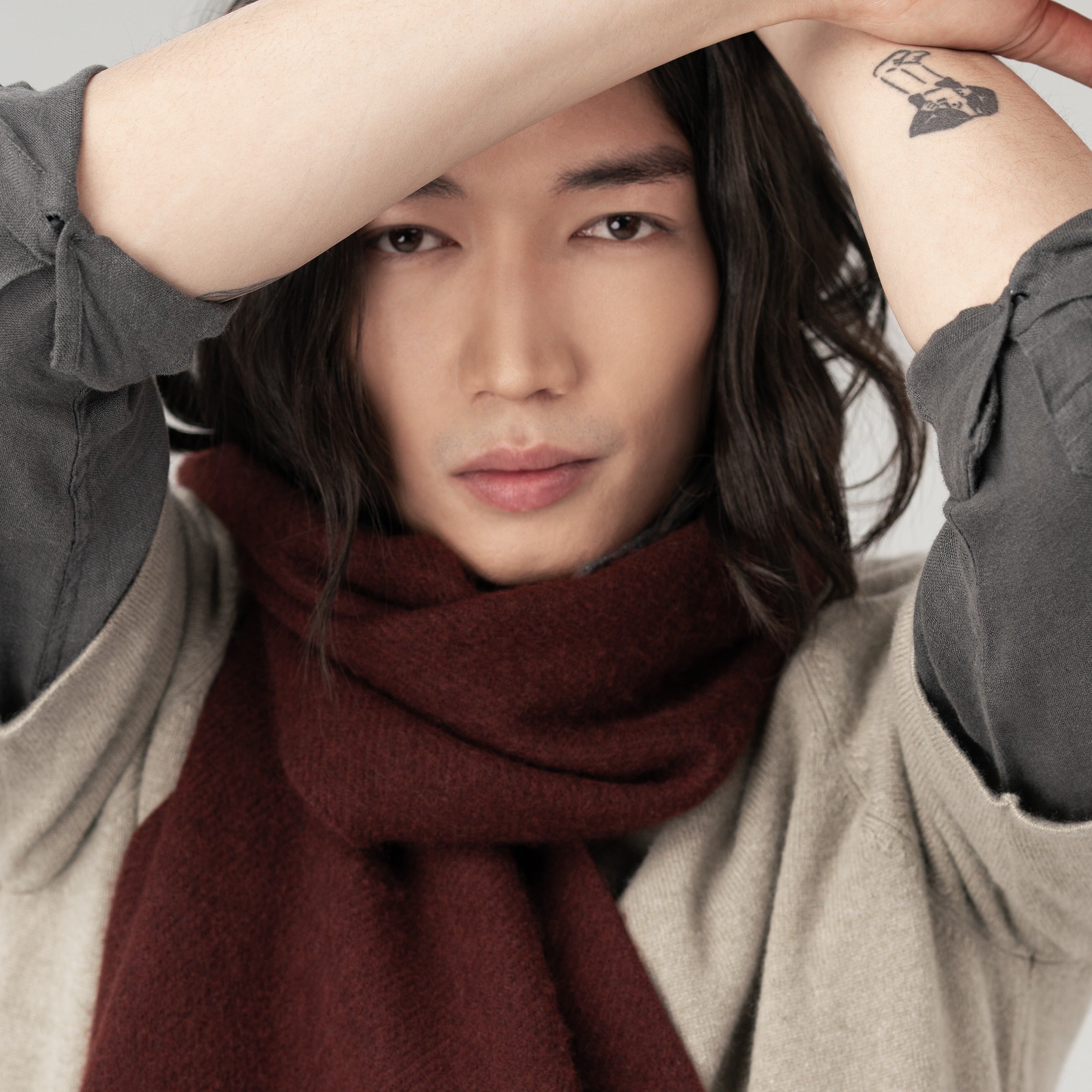 Model wearing a long cashmere scarf