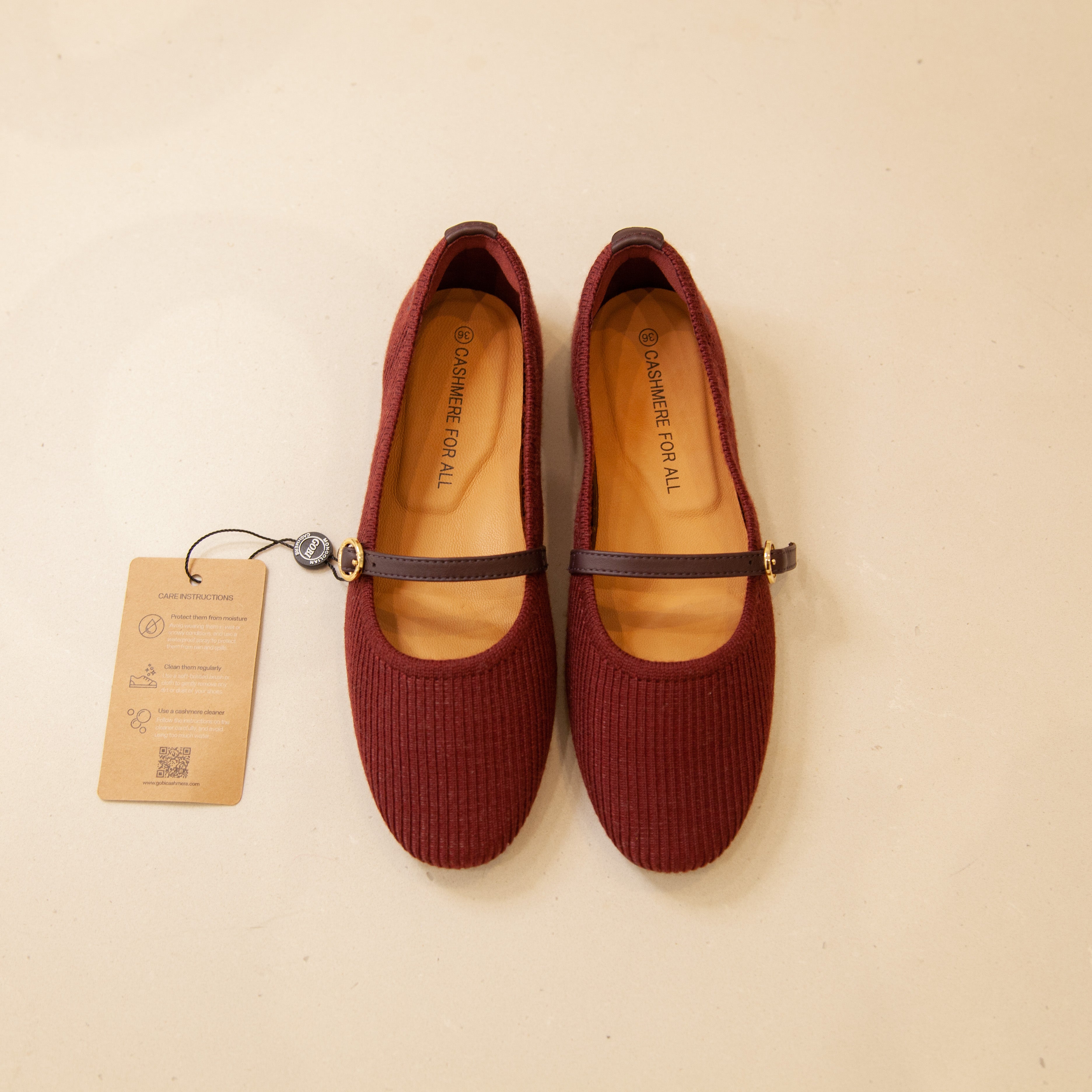 Burgundy cashmere Mary Jane shoes, flat lay, featuring a soft texture and classic, elegant design.