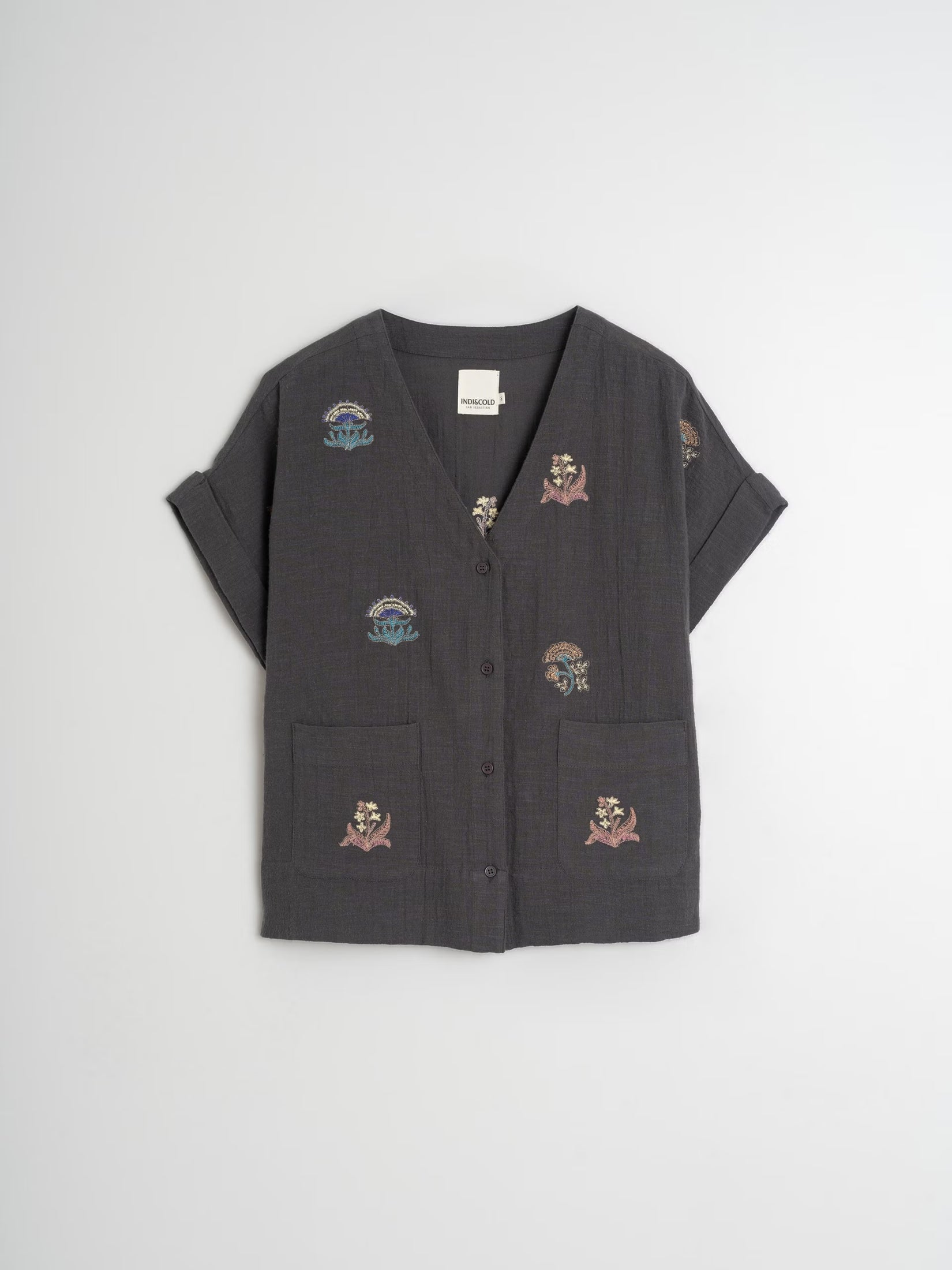 Flat lay of a carbon embroidered organic cotton shirt