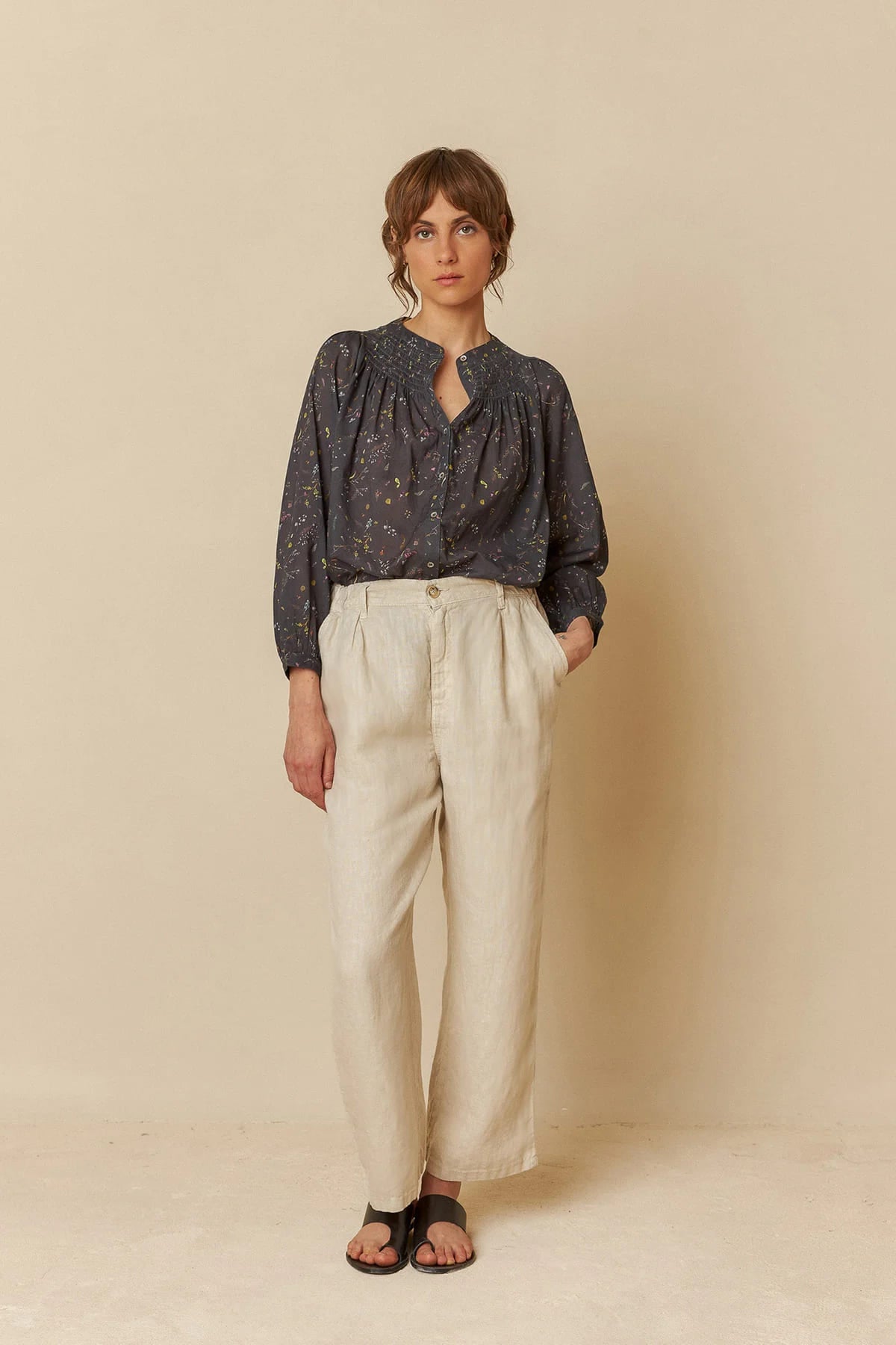 Model wearing relaxed-fit linen pants, showcasing a comfortable style.