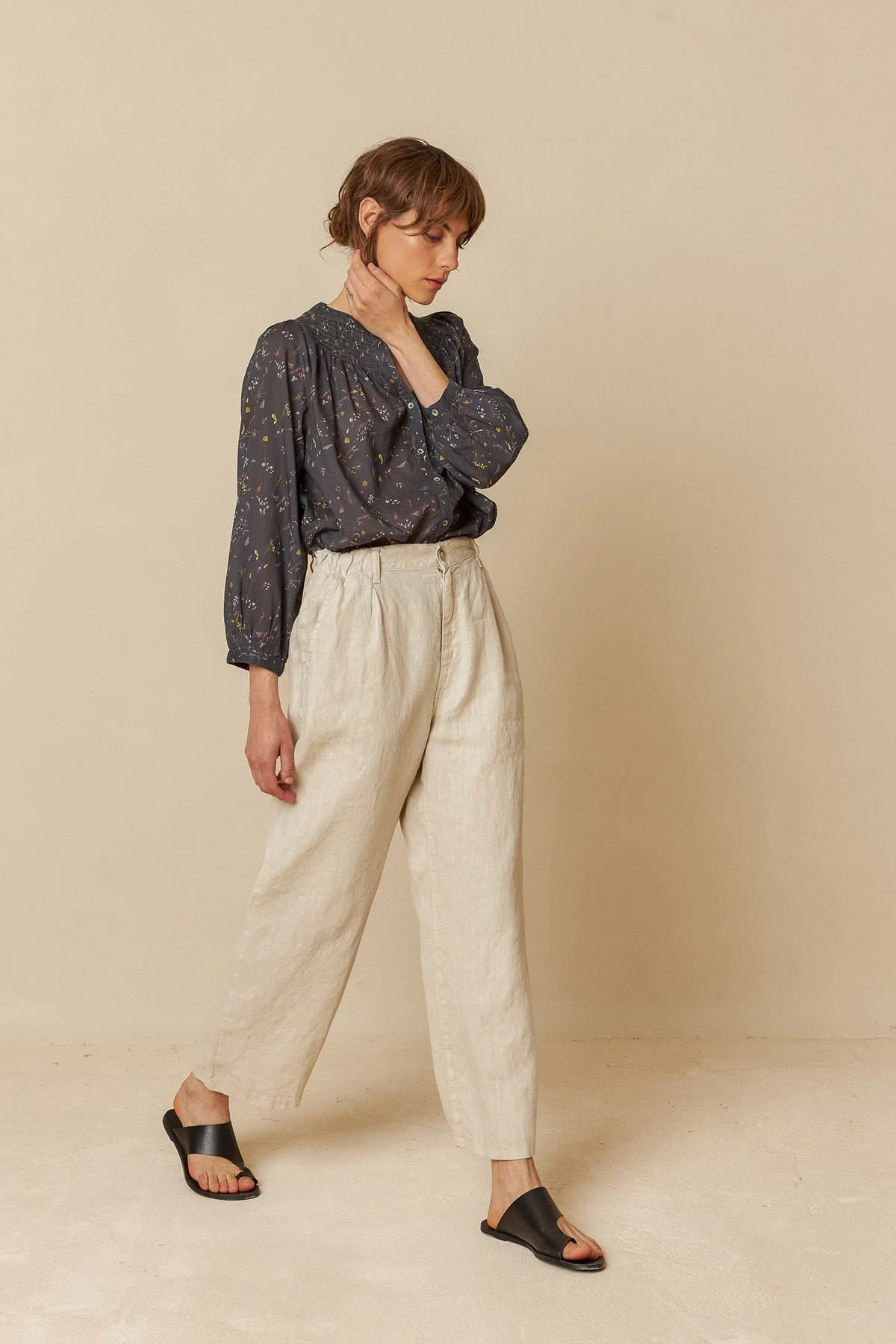 Model wearing relaxed-fit linen pants, showcasing a comfortable style.