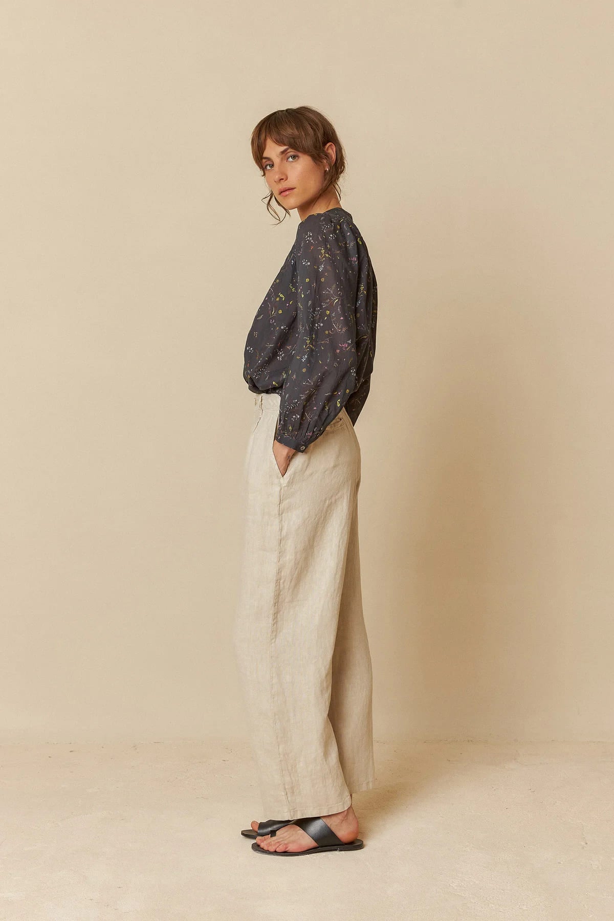 Model wearing relaxed-fit linen pants, showcasing a comfortable style.