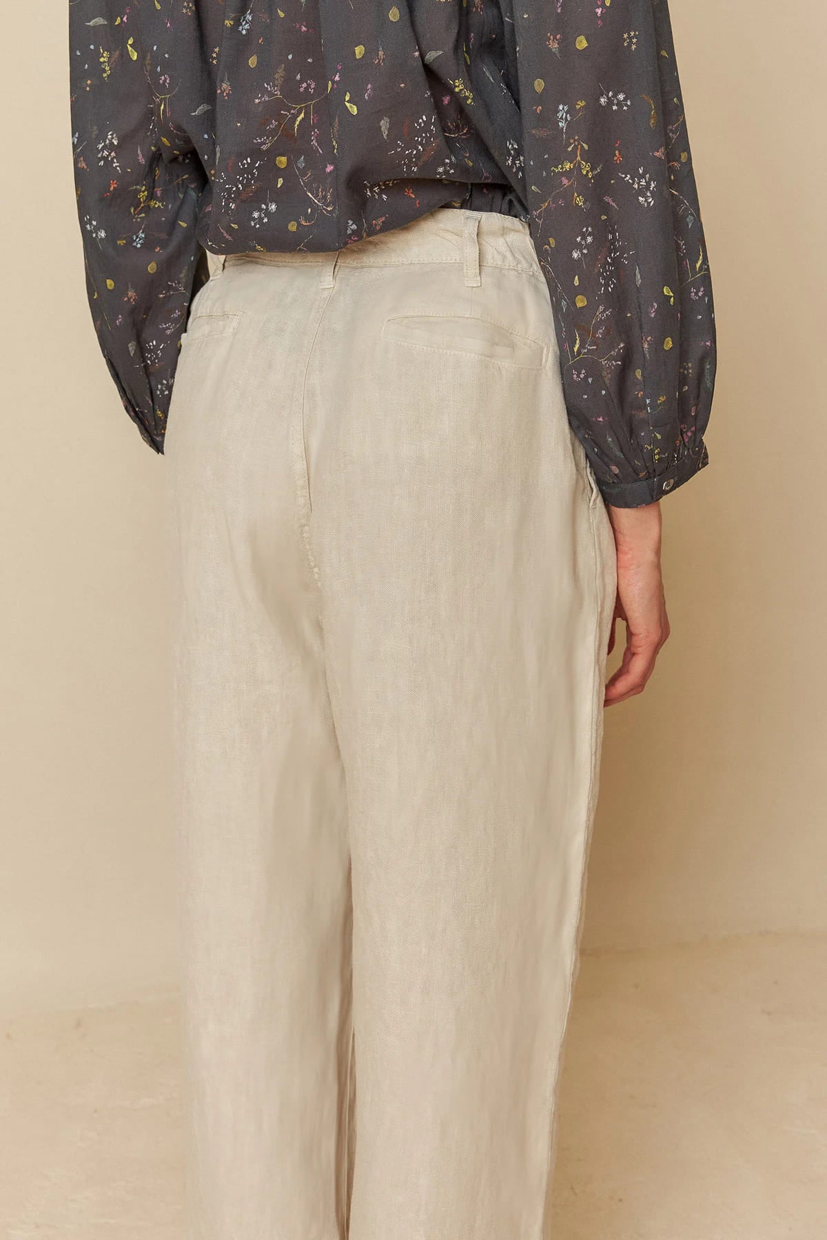 Model wearing relaxed-fit linen pants, showcasing a comfortable style.