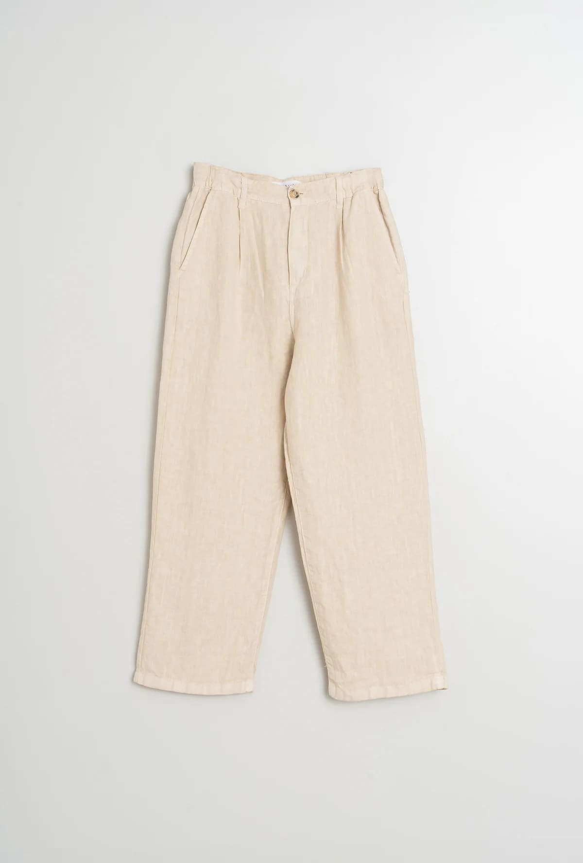 Flat lay of relaxed-fit linen pants in a soft, breathable fabric.