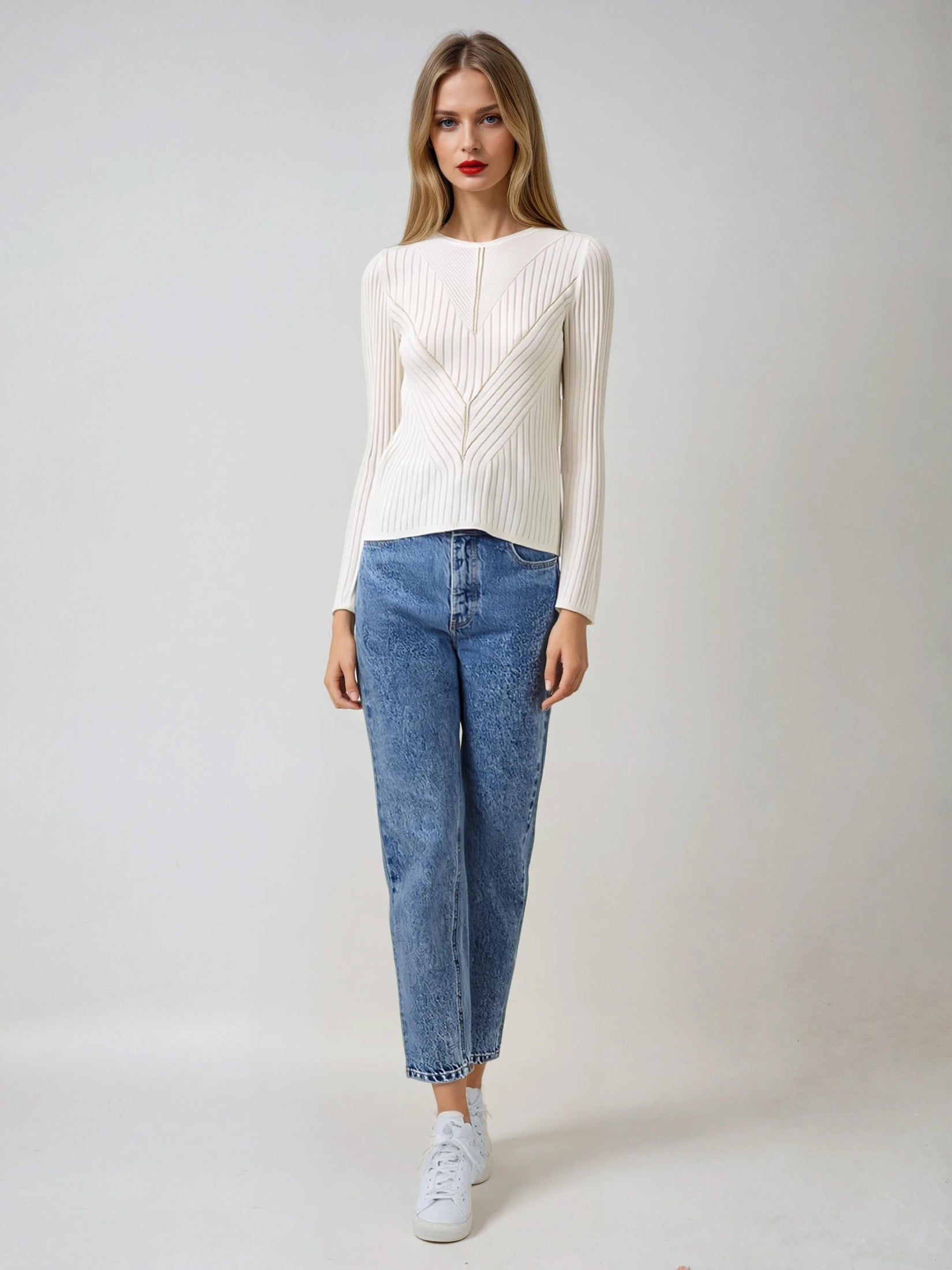 Model wearing a white silk cashmere rib knit, offering a soft and luxurious fit